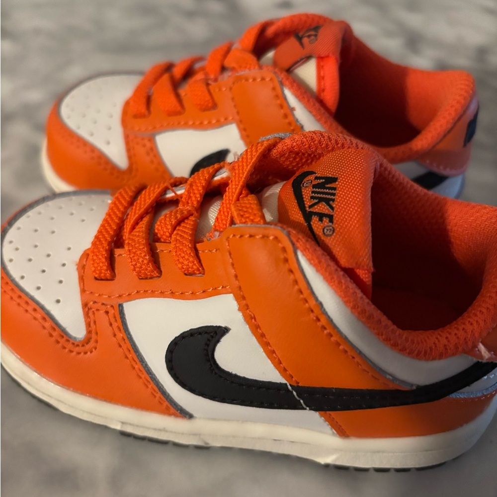 Nike Orange and White Sneakers with Classic Low-Top Design